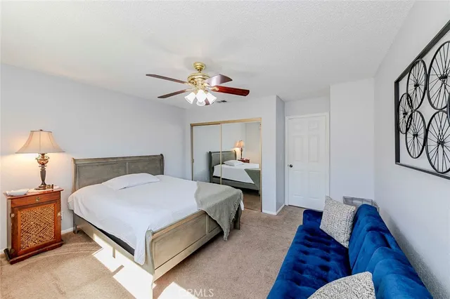 a bed room with furniture and a chandelier