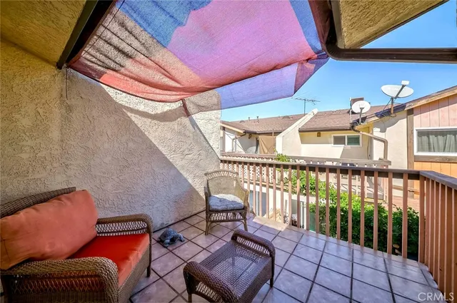 a outdoor space with patio couch and chairs