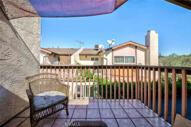 a balcony with furniture