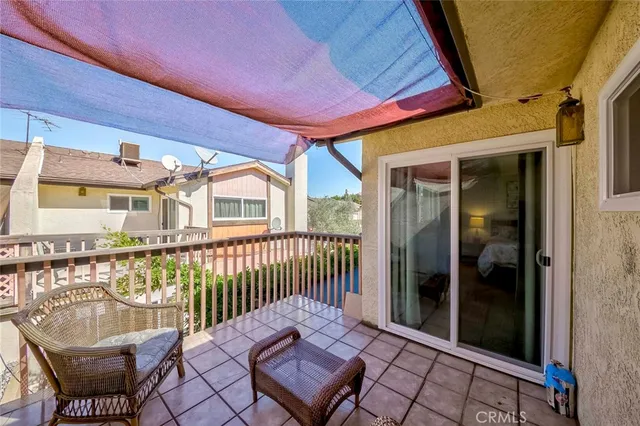 a view of a livingroom with furniture and a window