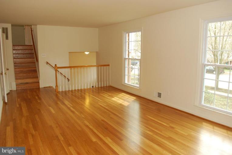 4205 Sleepy Hollow Road Annandale, VA 22003 - Photo 4 of 14 wooden floor in an empty room with a window