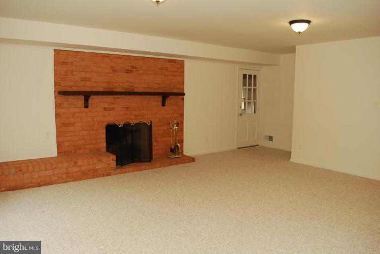 4205 Sleepy Hollow Road Annandale, VA 22003 - Photo 7 of 14 an empty room with fireplace