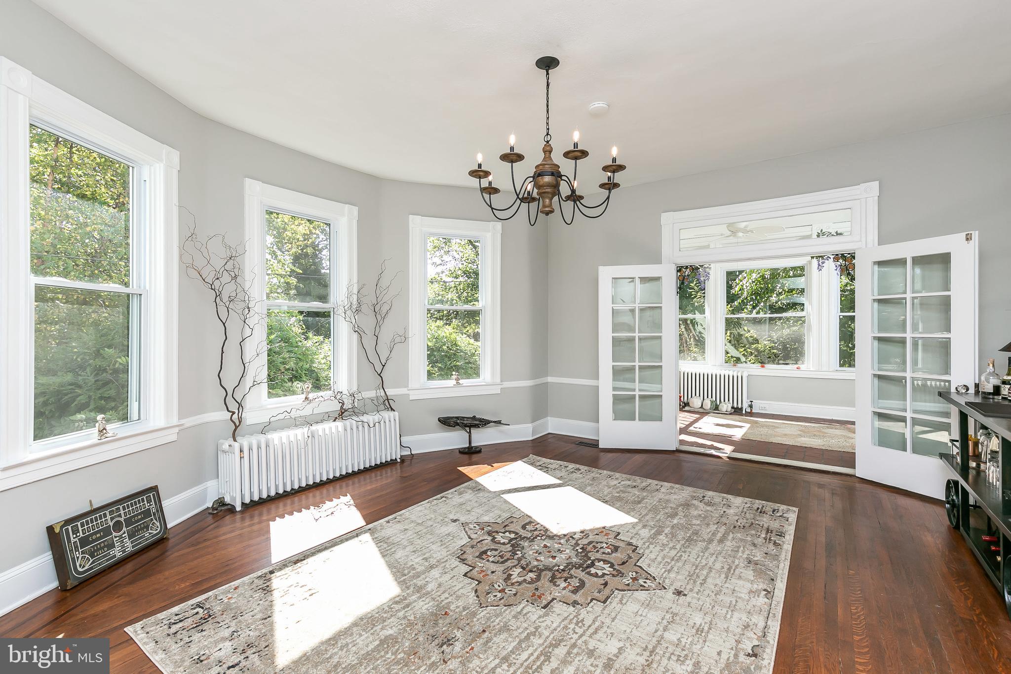 5506 Rusk Avenue Baltimore, MD 21215 - Photo 15 of 54 Expansive dining room with chandelier