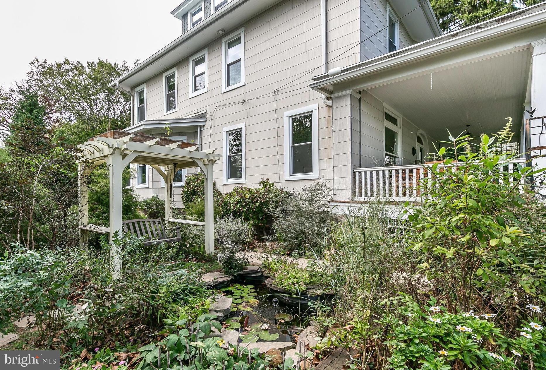 5506 Rusk Avenue Baltimore, MD 21215 - Photo 54 of 54 Fish pond and porch swing