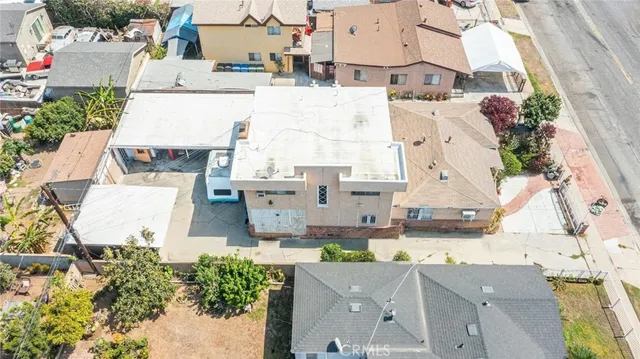 an aerial view of residential houses with outdoor space
