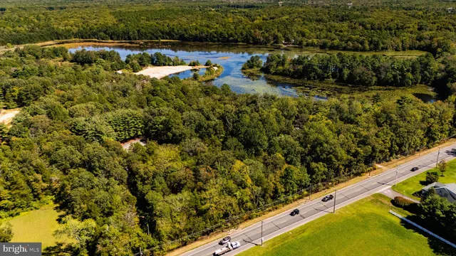 a view of a yard with wooden fence