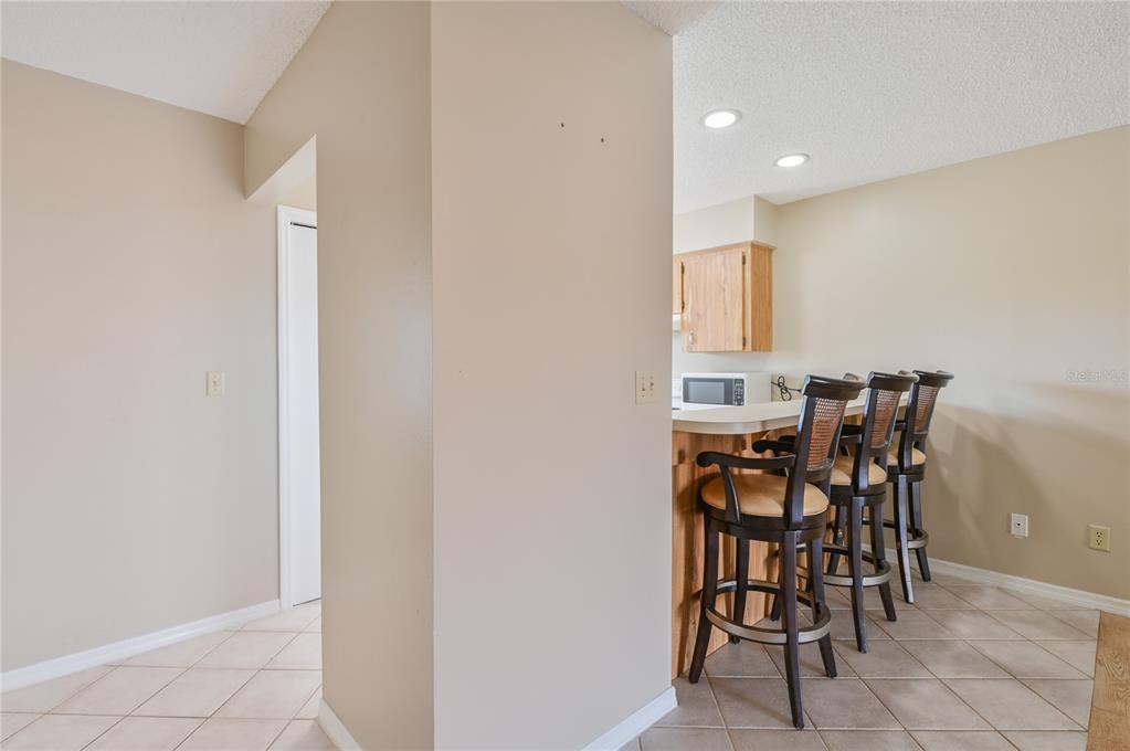 11001 Southeast Sunset Harbor Road, Unit H52 Summerfield, FL 34491 - Photo 18 of 31 a view of a dining room with furniture