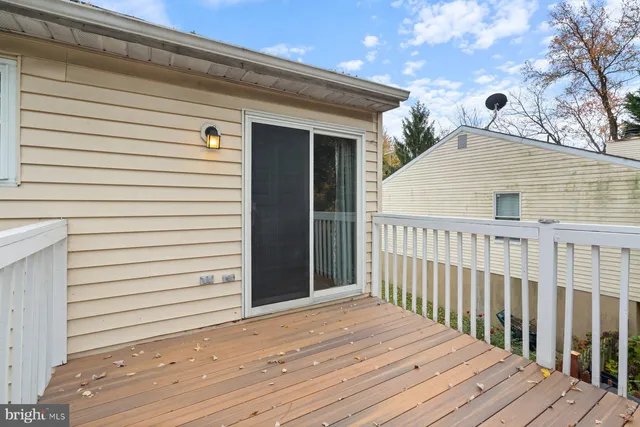 a view of a house with wooden deck