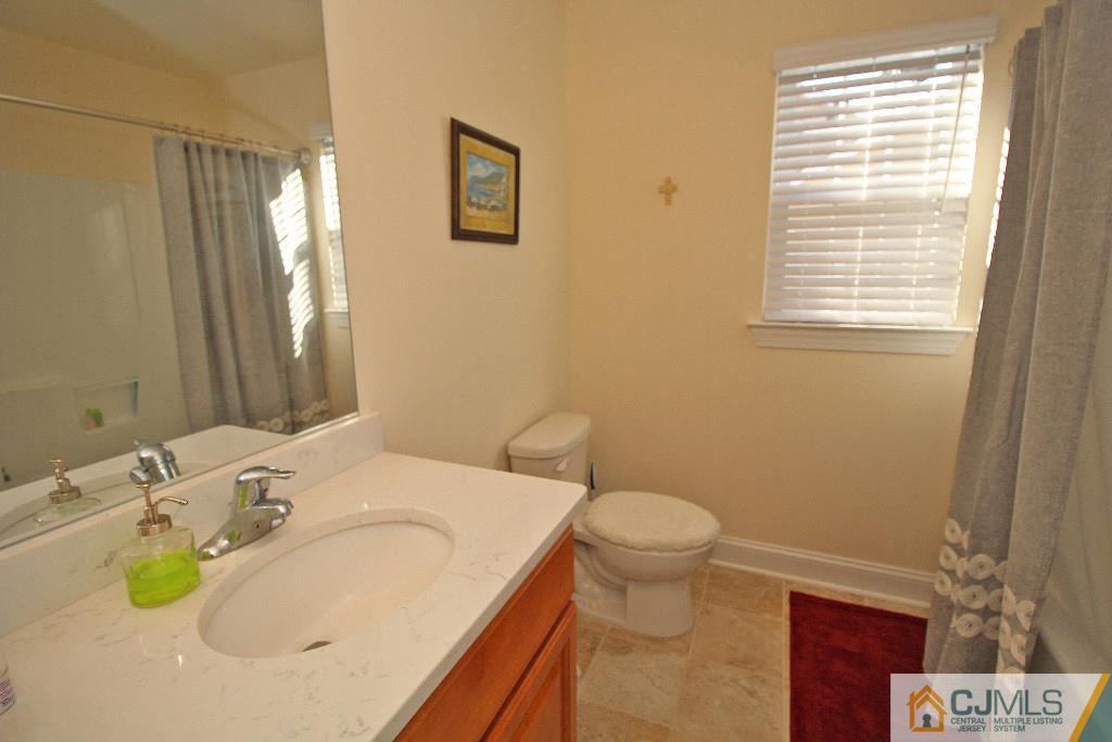579 Chain O' Hills Road Colonia, NJ 07067 - Photo 22 of 25 a bathroom with a sink and a mirror
