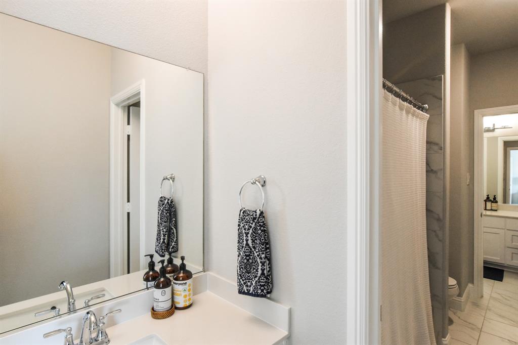 2516 Maidenhair Road Frisco, TX 75033 - Photo 25 of 30 a bathroom with a sink and a mirror