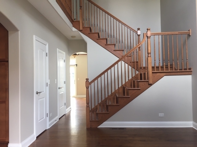172 Mayo Court Elmhurst, IL 60126 - Photo 2 of 6 a view of staircase with railing and white walls