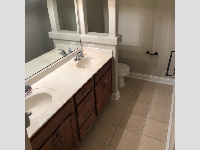 172 Mayo Court Elmhurst, IL 60126 - Photo 6 of 6 a bathroom with a sink a toilet and a mirror