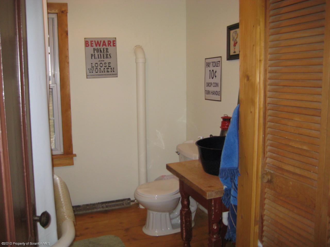 Rr2 Rr2 Ulster, PA 18850 - Photo 7 of 12 a bathroom with a toilet and a shower curtain