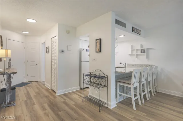 a view of a livingroom with furniture and hardwood floor