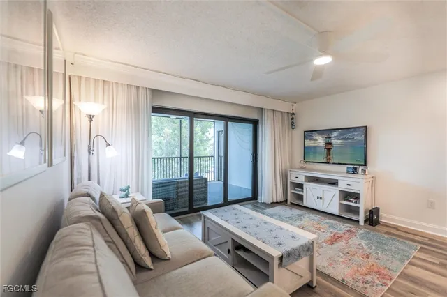 a bedroom with furniture and a flat screen tv