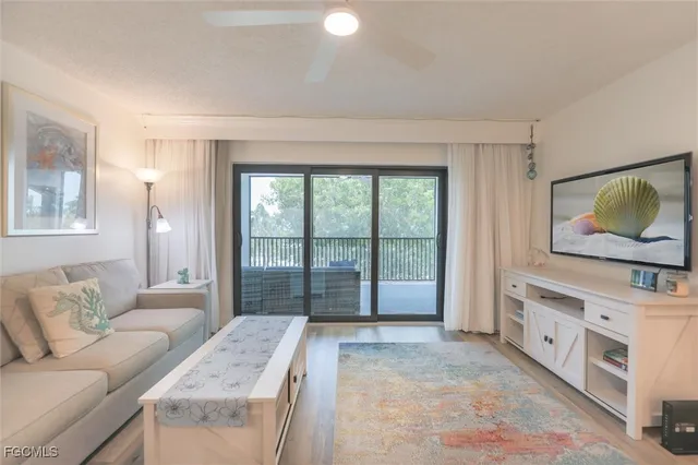 a bedroom with furniture and a flat screen tv