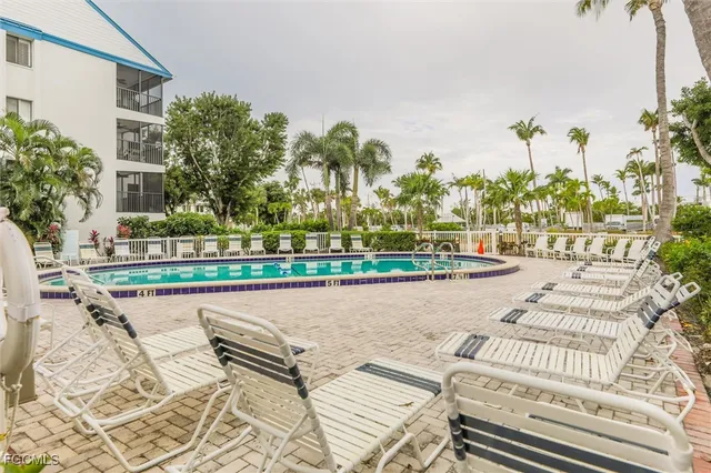 a wooden bench sitting in front of a house