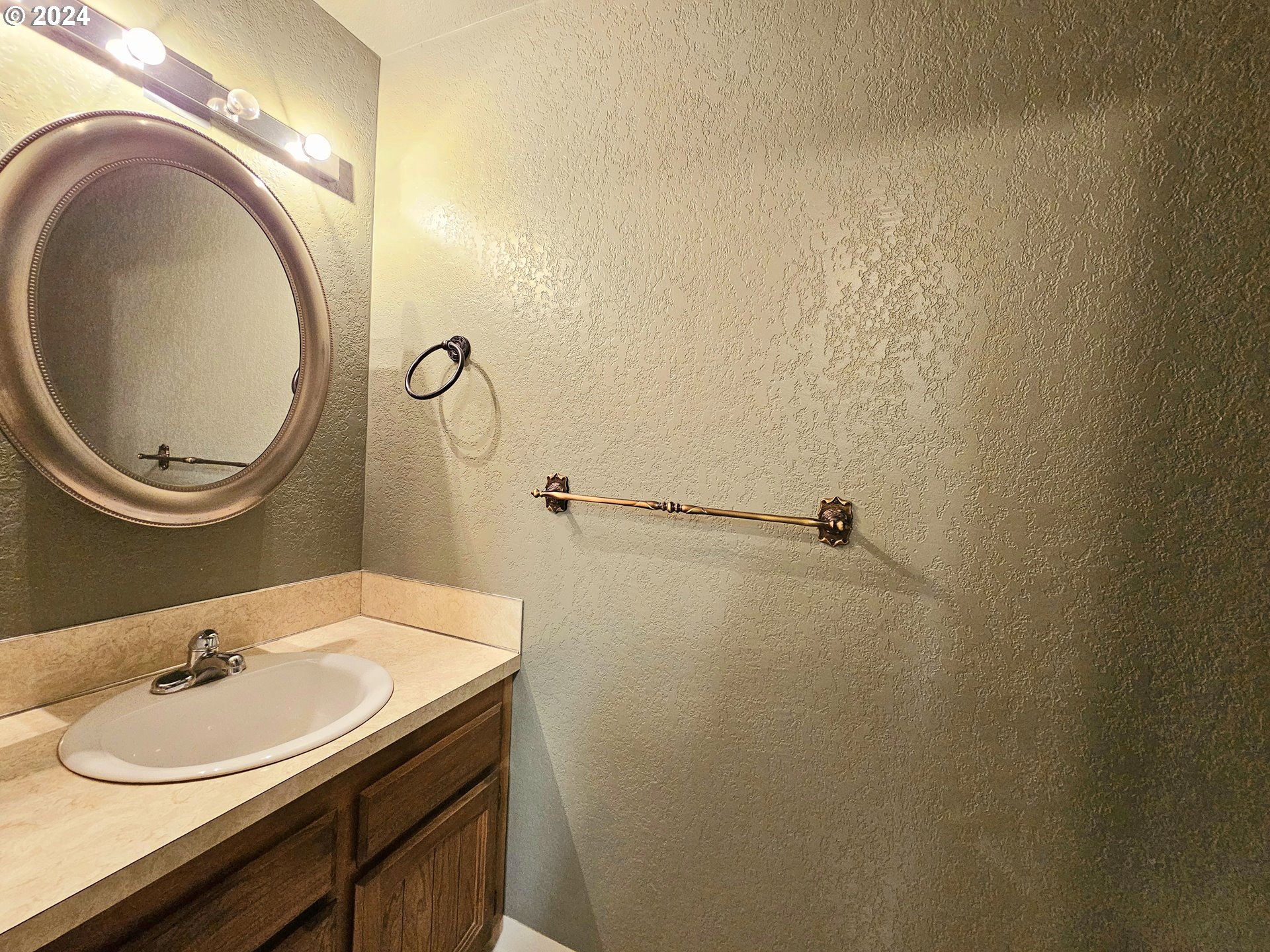 43605 Highway 38, Unit 36 Reedsport, OR 97467 - Photo 23 of 28 a bathroom with a sink and a mirror