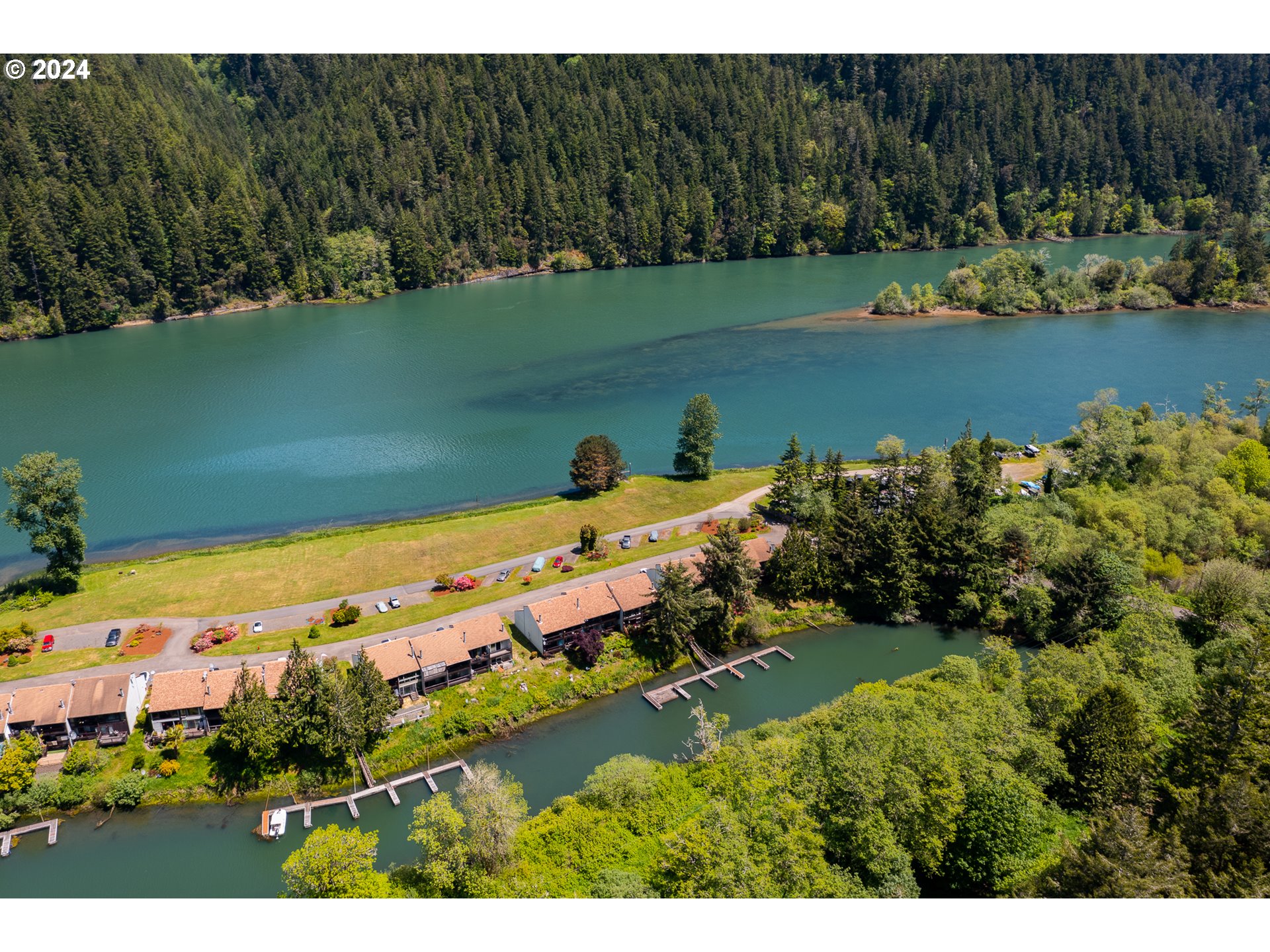 43605 Highway 38, Unit 36 Reedsport, OR 97467 - Photo 24 of 28 a view of a lake with a yard