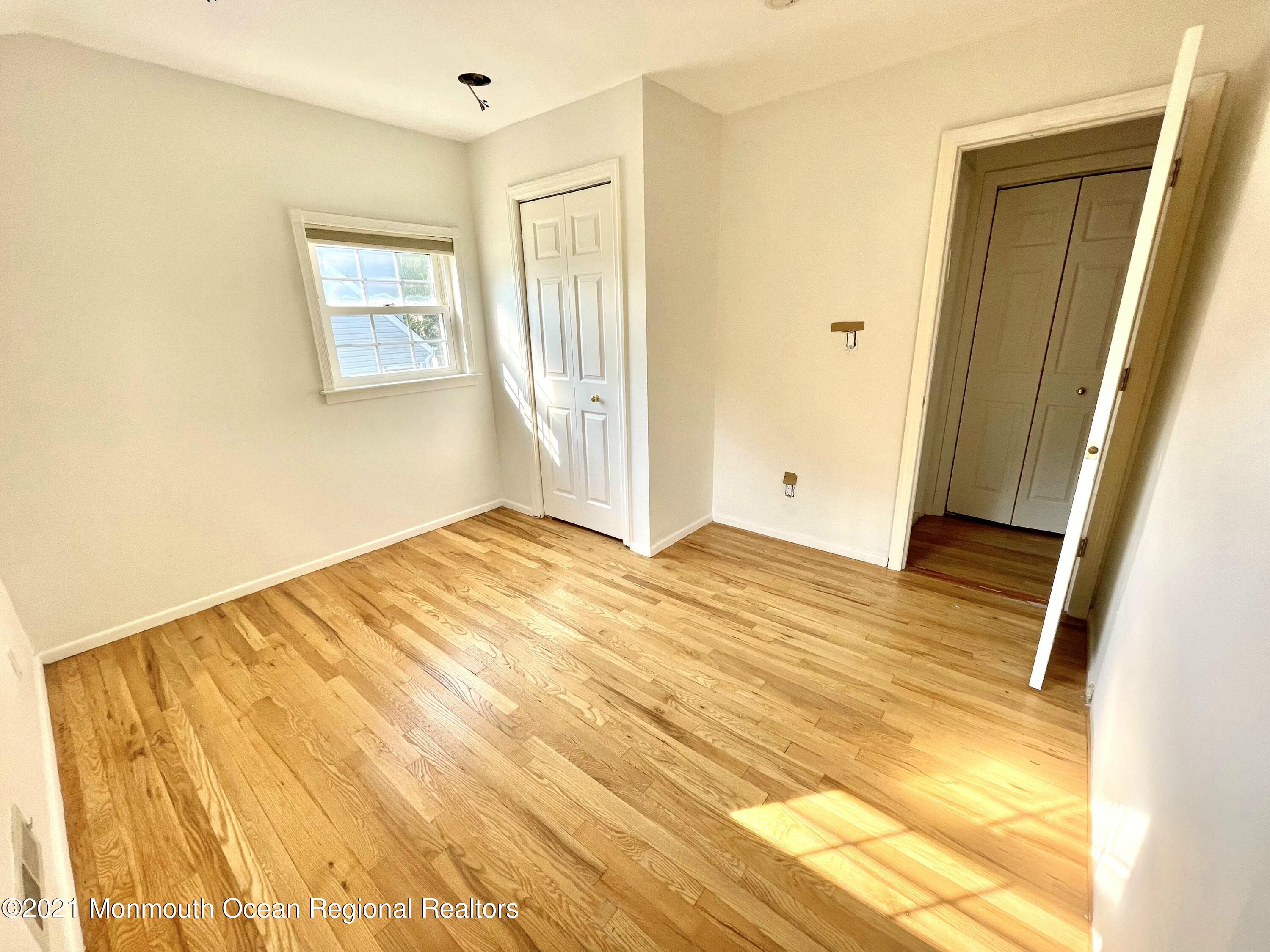 12 Branch Road Oakhurst, NJ 07755 - Photo 11 of 17 a view of a room with wooden floor and bathroom