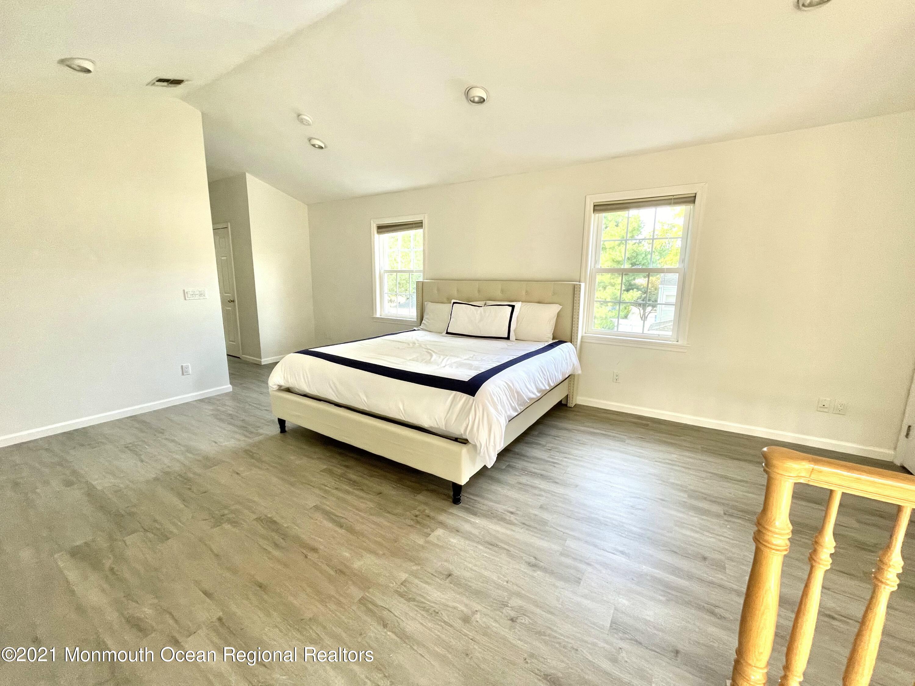 12 Branch Road Oakhurst, NJ 07755 - Photo 16 of 17 a spacious bedroom with a bed and a window