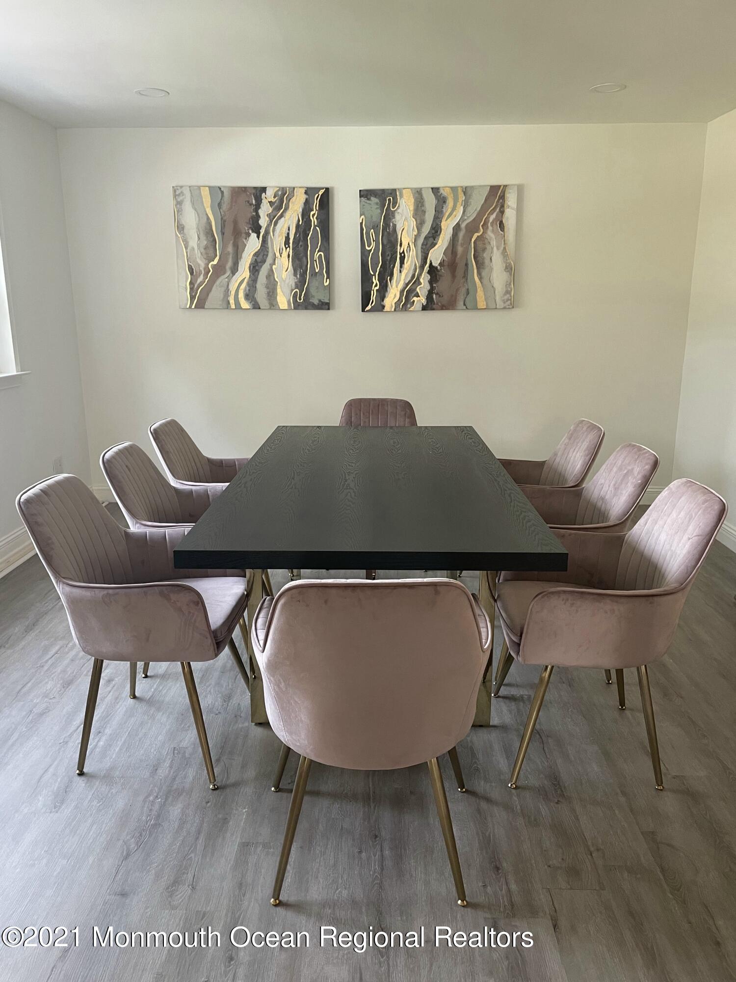 12 Branch Road Oakhurst, NJ 07755 - Photo 5 of 17 a table and chairs in a blue room