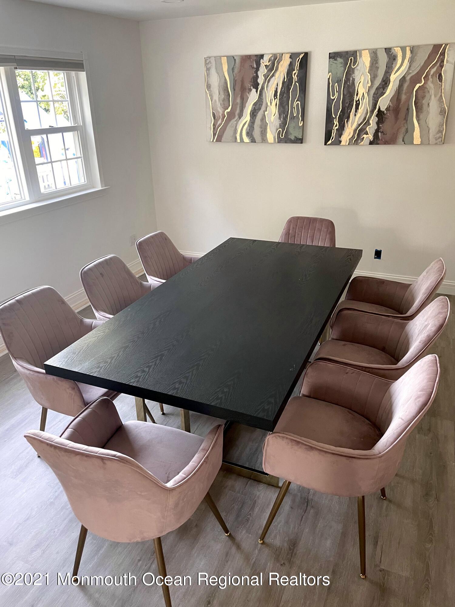 12 Branch Road Oakhurst, NJ 07755 - Photo 6 of 17 a balcony with table and chairs