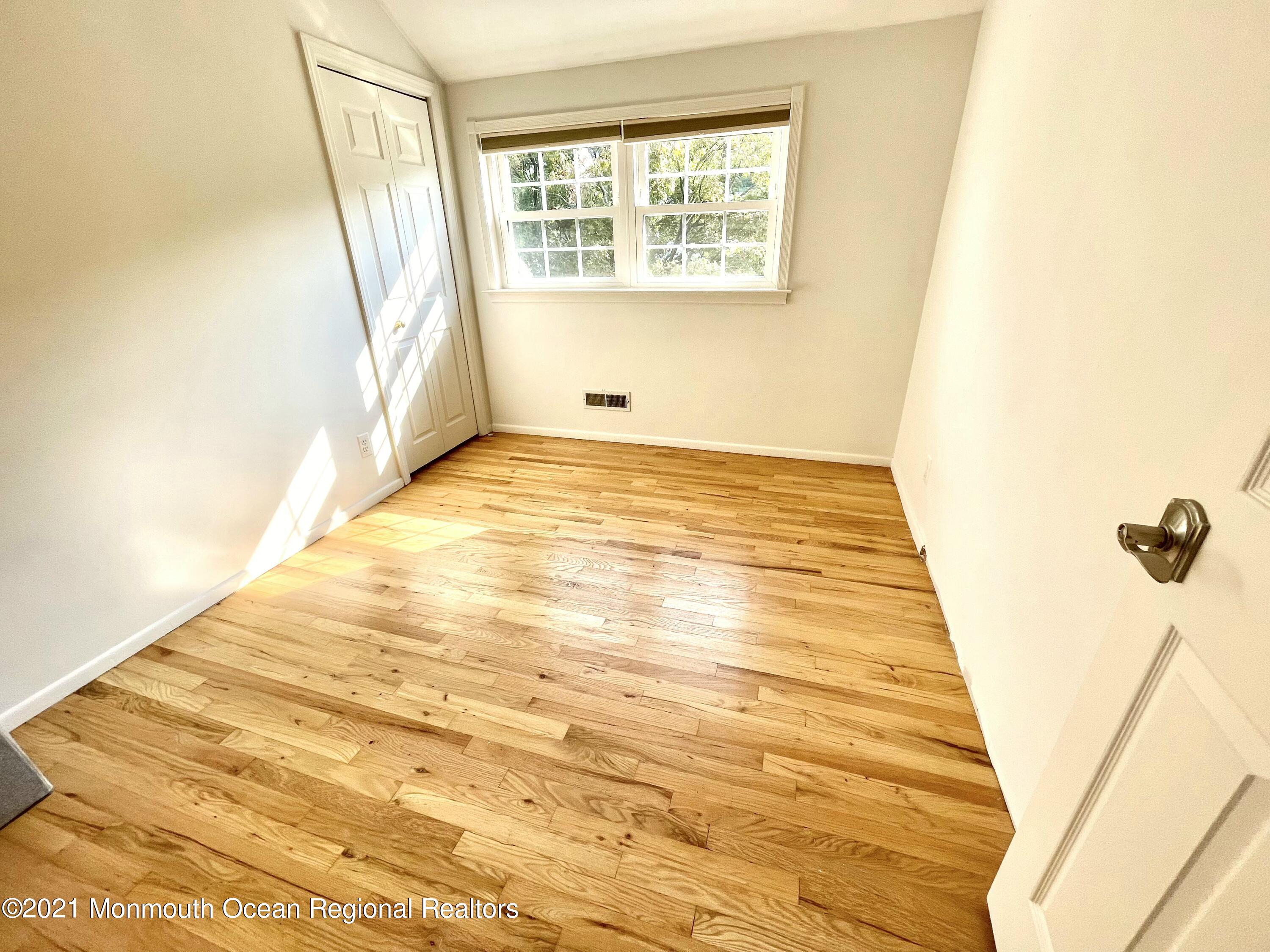 12 Branch Road Oakhurst, NJ 07755 - Photo 10 of 17 a view of an empty room with a window