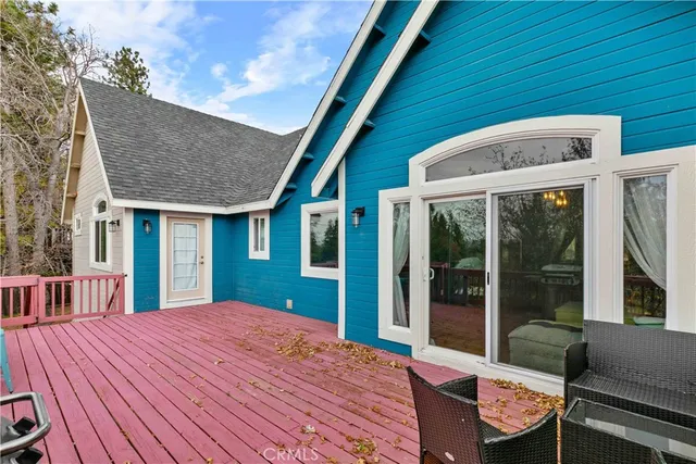 a view of a patio with a table and chairs