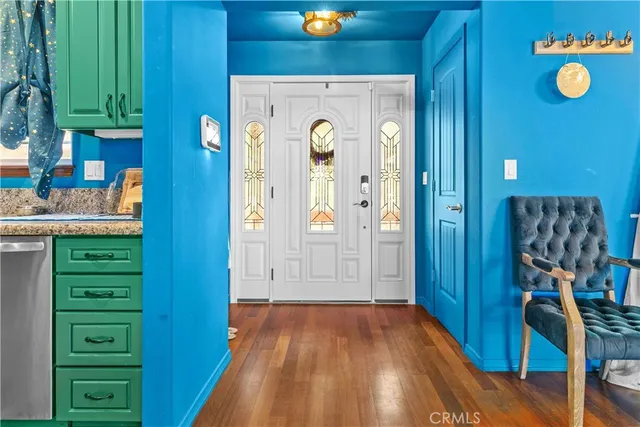 a living room with furniture and a lamp