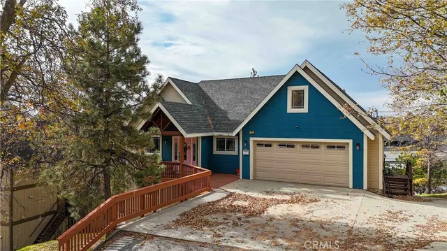a front view of a house with trees