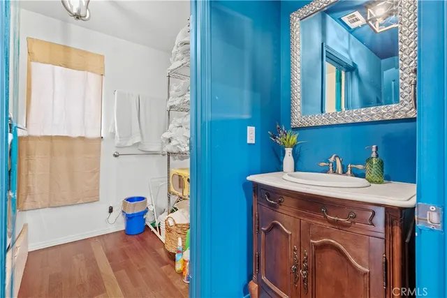 a bathroom with a double vanity sink and a mirror