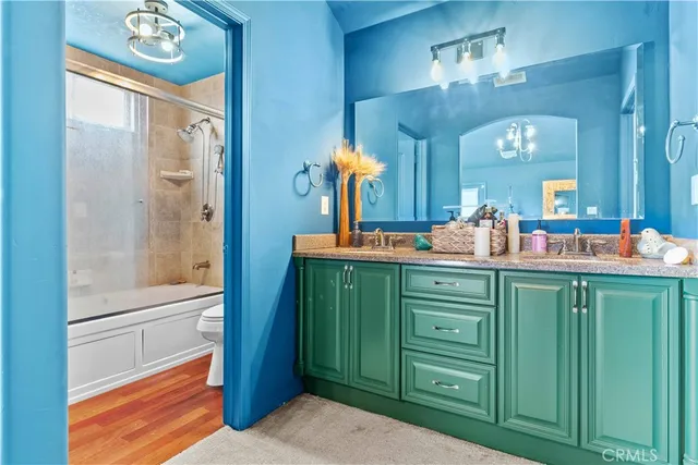 a bathroom with a double vanity sink and a mirror