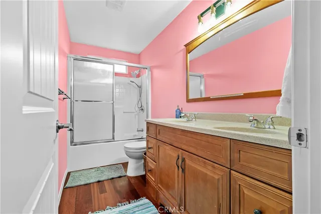 a bathroom with a sink vanity and a mirror