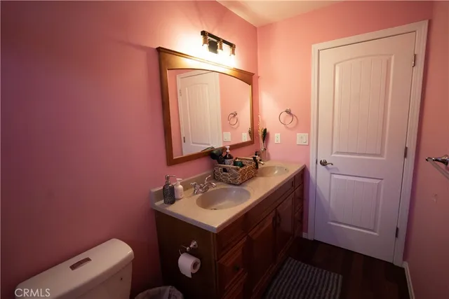 a bedroom with two beds and a window