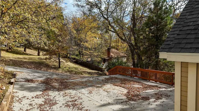 a view of backyard and trees
