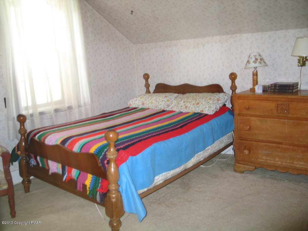 Summit Road Swiftwater, PA 18370 - Photo 12 of 12 a bedroom with a bed and dresser
