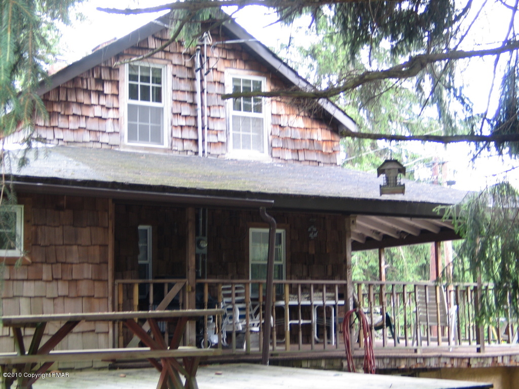 Summit Road Swiftwater, PA 18370 - Photo 3 of 12 a front view of a house with a porch