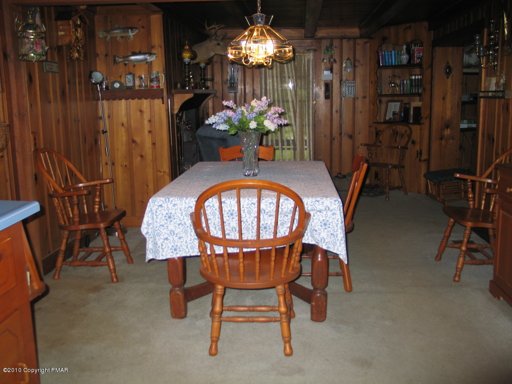 Summit Road Swiftwater, PA 18370 - Photo 4 of 12 a view of a dining room with furniture and chandelier