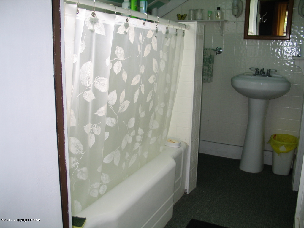 Summit Road Swiftwater, PA 18370 - Photo 7 of 12 a bathroom with a sink and a bathtub