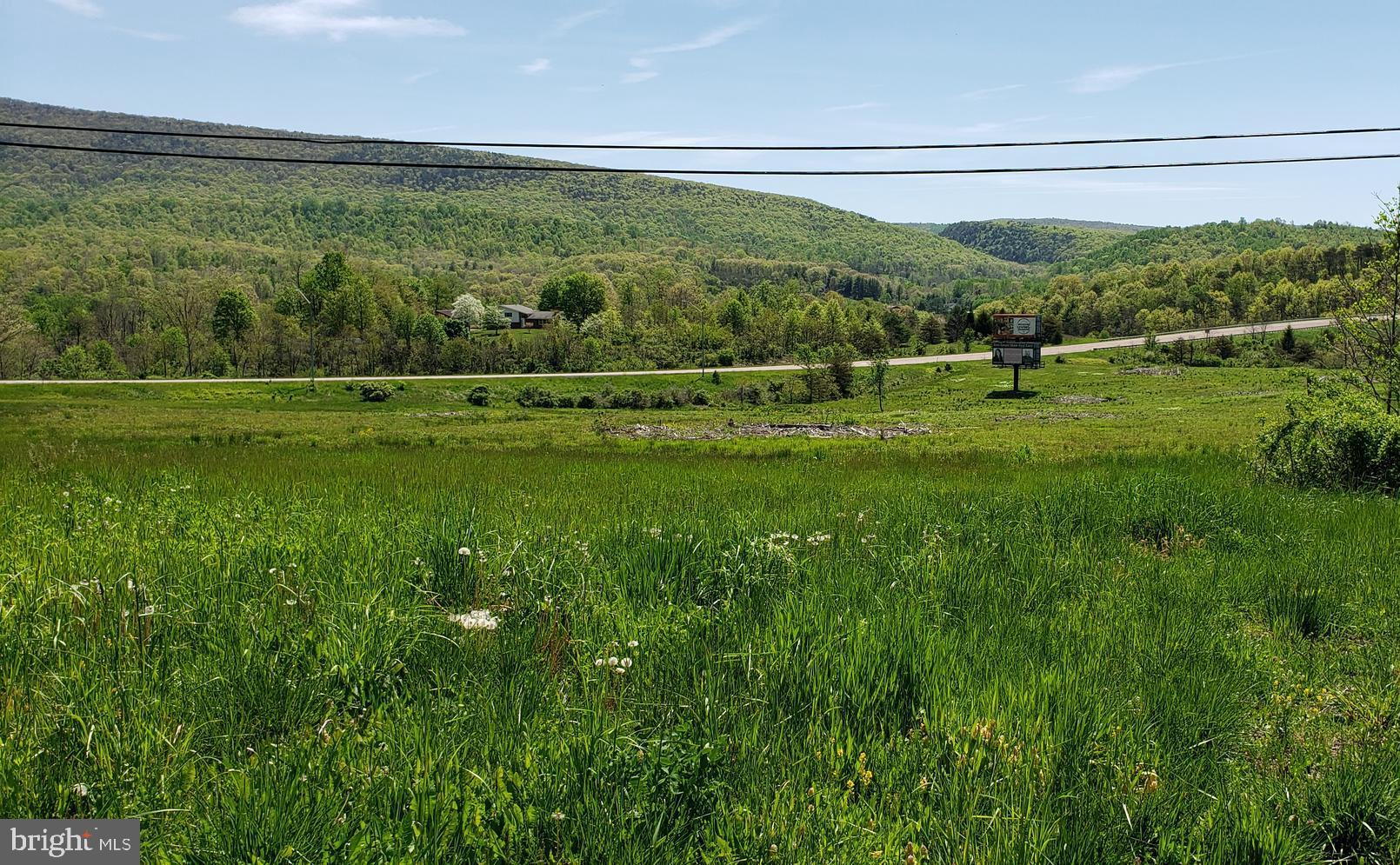 13910 Bedford Road Northeast Cumberland, MD 21502 - Photo 6 of 6 a view of a green field with clear sky