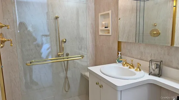 a bathroom with a sink and mirror