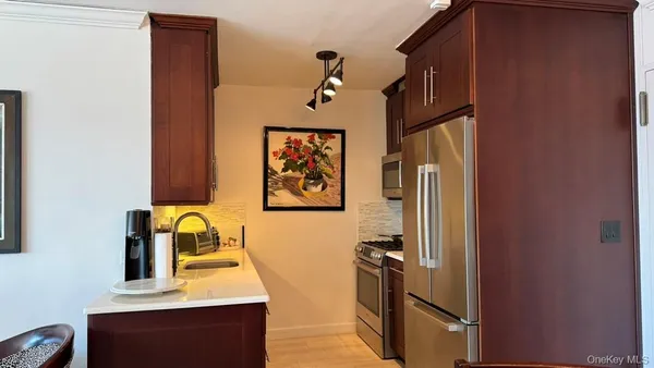 a view of kitchen with a refrigerator