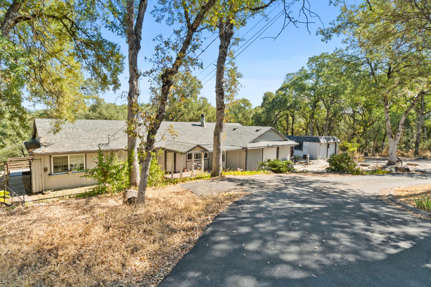 a view of a house with a yard covered in snow