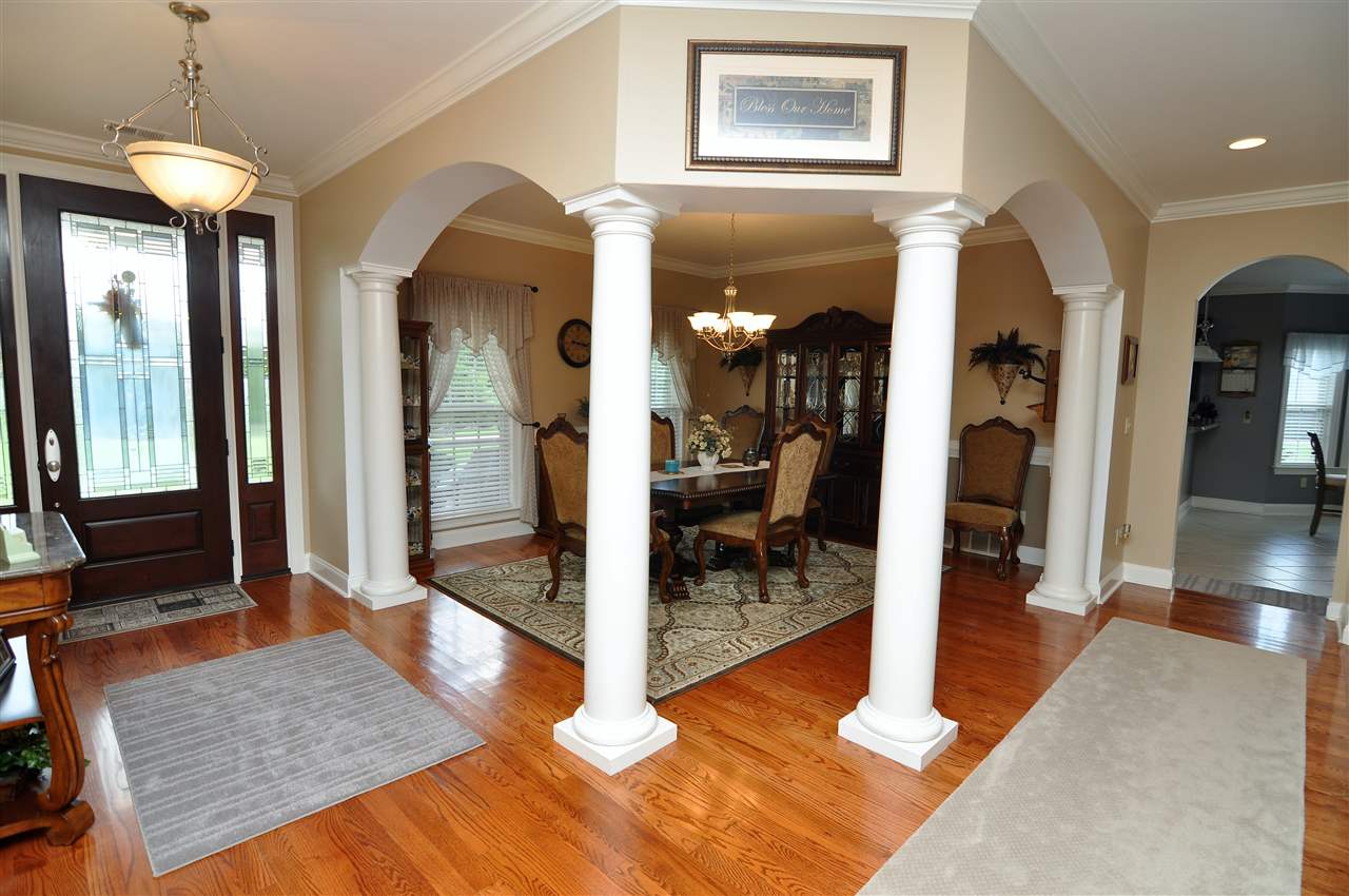 4420 Price Road Moscow, TN 38057 - Photo 1 of 25 Step inside and be greeted by gleaming hardwood floor, extensive crown molding and beautiful columns and archways.
