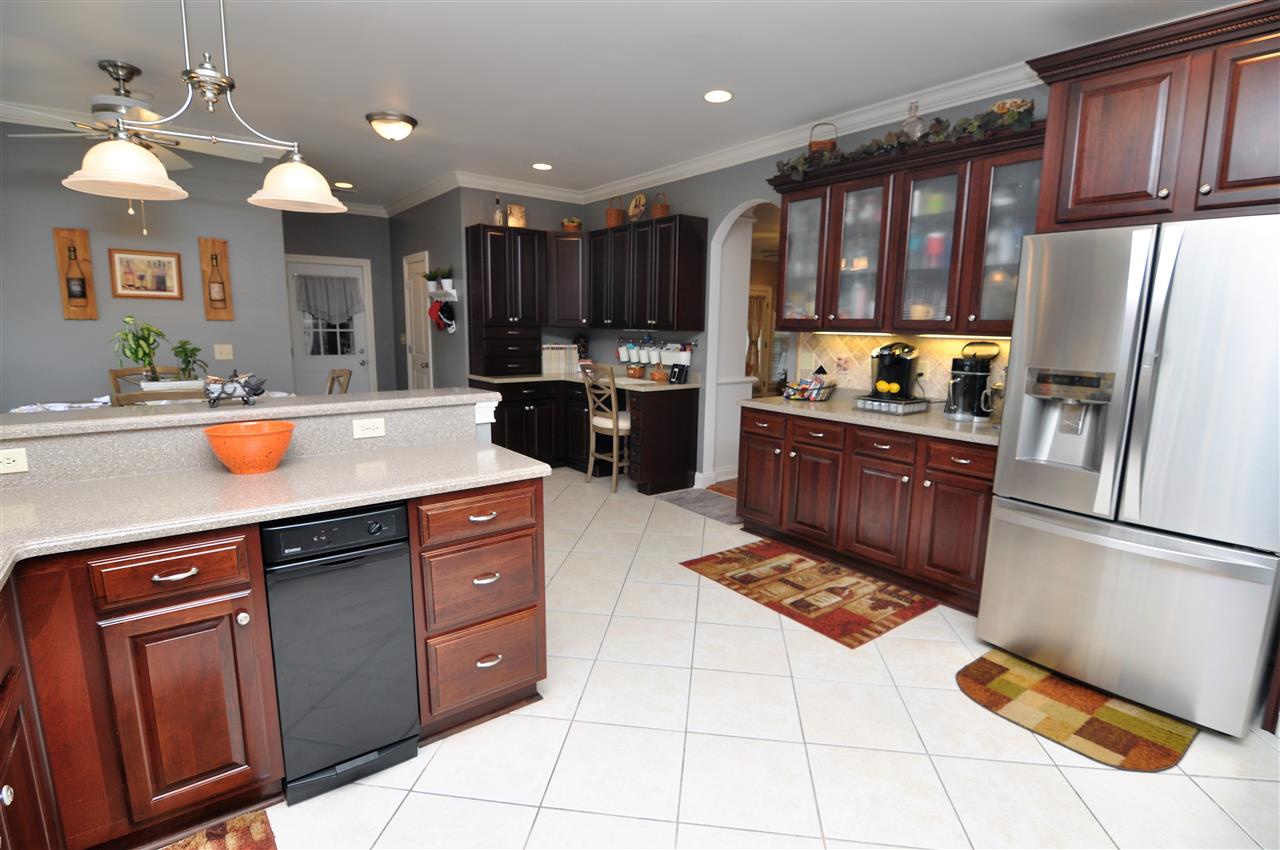 4420 Price Road Moscow, TN 38057 - Photo 2 of 25 The kitchen features beautiful custom cabinets with display cabinets including a built-in desk area.