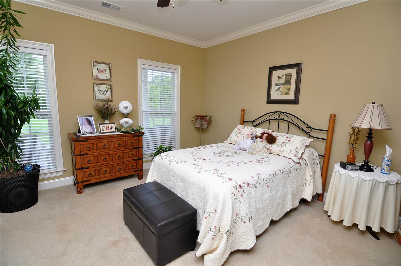 4420 Price Road Moscow, TN 38057 - Photo 19 of 25 The 2nd bedroom is also downstairs and features carpet, high ceilings with fan, and crown molding.
