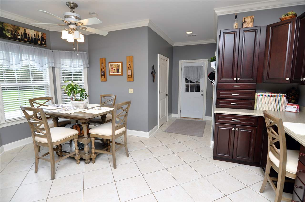 4420 Price Road Moscow, TN 38057 - Photo 3 of 25 Enjoy your morning coffee in the separate breakfast area with bay window and ceiling fan. A half bath and laundry room is just off the kitchen near the garage entrance.