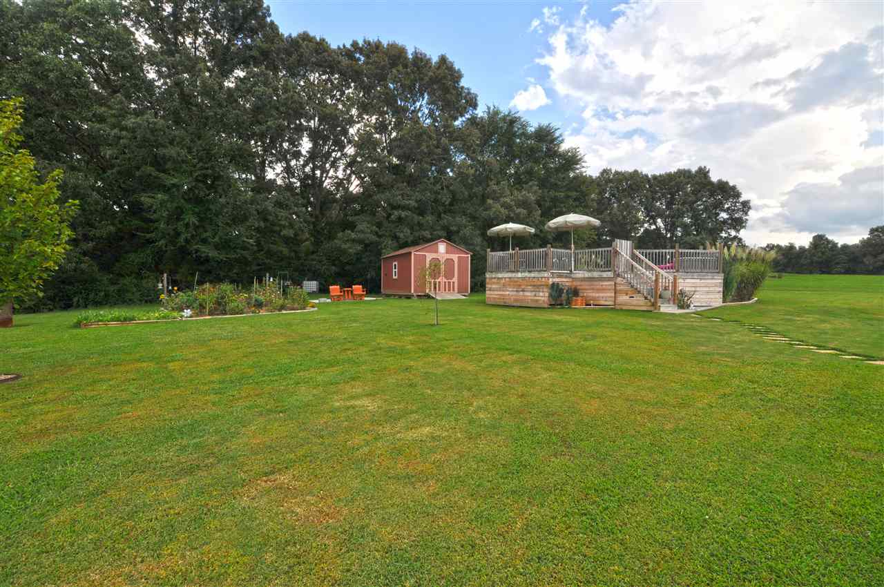 4420 Price Road Moscow, TN 38057 - Photo 9 of 25 This home also features a large above ground pool surrounded by a custom deck with safety gate as well as a storage building to store all your pool supplies.