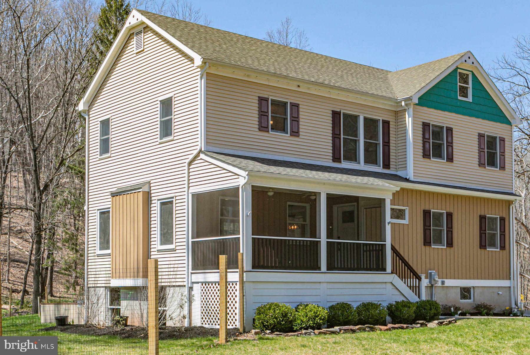 310 Hollow Road Skillman, NJ 08558 - Photo 2 of 32 a house view with a garden space